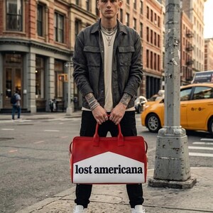 At the bottom, the Lost Americana bag includes protective metal feet (studs)