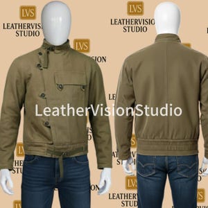 May include: An olive green jacket with a stand-up collar, asymmetrical button closure, and a chest pocket. The jacket has a belt at the waist and is displayed on a mannequin. The text "LeatherVisionStudio" is visible.