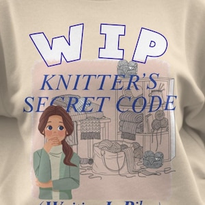 May include: A beige crewneck sweatshirt featuring a graphic illustration of a person standing next to shelves and a basket filled with yarn. The text reads WIP KNITTER'S SECRET CODE (Waiting In Piles) in blue lettering with a light pink background.
