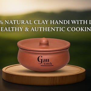 May include: A terracotta-colored clay handi with a lid, sitting on a wooden stand. The handi has a rounded shape with a knob on the lid. The text "100% NATURAL CLAY HANDI WITH LID - HEALTHY & AUTHENTIC COOKING" is displayed above the handi.
