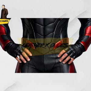 May include: Black and red superhero costume with a segmented design. The costume features black gloves, red accents on the arms, and a gold belt. The image includes the text "LEATHER X DUDES".