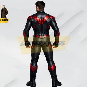 May include: A black and red leather suit with a high collar and a form-fitting design. The suit features red accents on the shoulders, chest, and legs. The model is wearing black gloves and boots. The logo "LEATHER X DUDES" is visible.