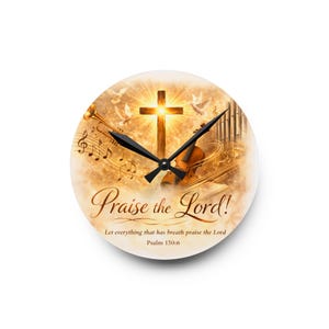 May include: Circular wall clock with a religious design. The clock face displays a cross, musical notes, a trumpet, and a violin. The words "Praise the Lord!" are written in script, with a Bible verse below.