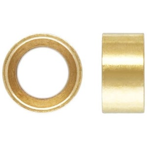 May include: Two gold-colored metal rings, one with a hole in the center and the other solid.