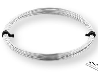 May include: A coil of silver wire, approximately 20 gauge, with a round cross-section. The wire is wrapped around itself and secured with black ties.