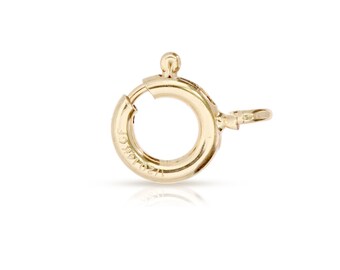 Könnte beinhalten: Ein goldfarbener Metallverschluss mit einem runden Ring und einem kleinen Haken. Der Verschluss ist mit dem Text "14K Italy" gekennzeichnet.