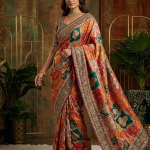 Viscose satin crepe saree with mirror work all over. Fully mirror worked blouse.Most demanded exclusive patchwork inspired design.