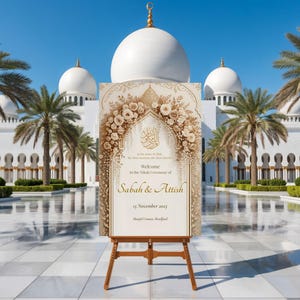 Nikah welcome sign with gold floral arch displayed in front of a white UAE-style mosque with palm trees.