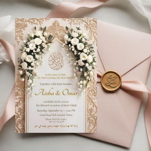 Nikah invitation card with gold arch, white florals and Arabic text styled with blush envelope and wax seal.