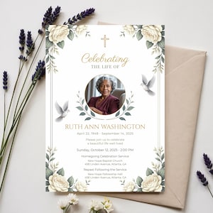 May include: A memorial invitation with a photo of Ruth Ann Washington, framed by floral and dove illustrations. The text reads "Celebrating the Life of" and includes dates, service details, and location information. The design features a gold cross.