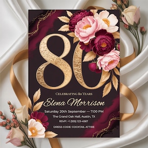 May include: An 80th birthday invitation with a burgundy and gold design. It features floral arrangements in pink, white, and burgundy. The invitation includes the name "Elena Morrison" and event details, with the dress code as "COCKTAIL ATTIRE".