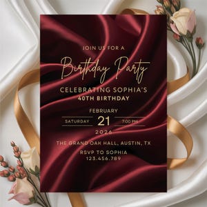 Luxury burgundy silk birthday invitation with gold lettering on white silk fabric with ribbon and flowers