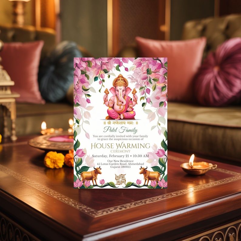 Hindu house warming invitation featuring Lord Ganesha and pink florals, elegant griha pravesh ceremony card styled in a cozy living room setting