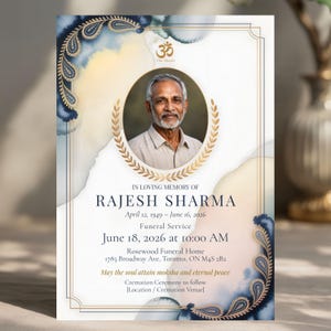 May include: A memorial card with a portrait of a man, framed by a gold laurel wreath. The card features text in a formal font, with a watercolor background in shades of blue and gold. The card includes the text "In Loving Memory of Rajesh Sharma."