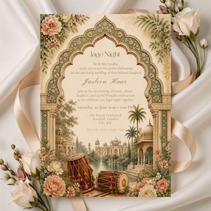 May include: A rectangular Jago Night wedding invitation card featuring an ornate archway, floral illustrations, and two dhol drums. The text includes details for Jasleen Kaur's celebration on Saturday, 20 June 2026, at The Royal Courtyard in Southall, London.
