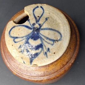 MCM art pottery honey pot earth tones Blue hand painted bee on lid. Makers mark Riegger Pottery stoneware pot with lid.