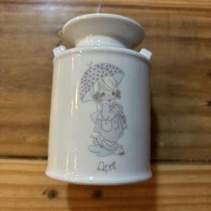 Vintage precious moments ceramic milk-can with a girl holding an umbrella, april