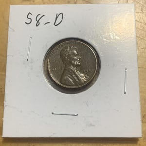 Moneda de un centavo de trigo de bronce de Lincoln de 1958, en estado de circulación promedio