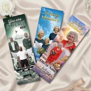 May include: Three memorial bookmarks with images of people and angel wings. The bookmarks have text that reads "You are at peace now" and "In loving memory." The bookmarks also include names and dates.