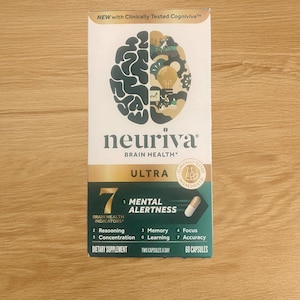 May include: A white and gold box of Neuriva Ultra dietary supplements. The box features a stylized brain graphic and lists seven brain health indicators, including mental alertness and memory. The box also states "60 capsules".