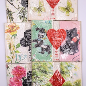 May include: A collection of vintage HyTone tallies, each with unique illustrations. Designs include butterflies, flowers, a poodle, a kitten, and landscapes. Each tally includes score cards. The tallies are wrapped in clear plastic.