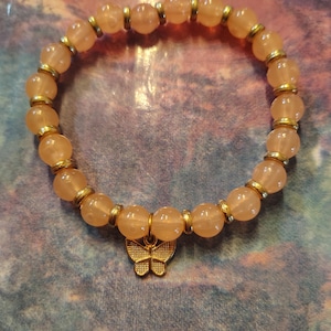 Pink bracelet with Butterfly Charm