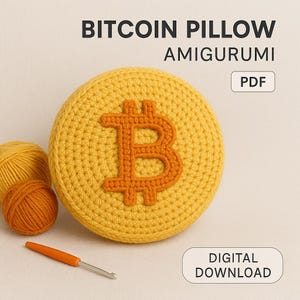 May include: A crocheted Bitcoin pillow in yellow with an orange Bitcoin symbol. The image includes two balls of yarn, a crochet hook, and text that reads "Bitcoin Pillow Amigurumi PDF Digital Download."