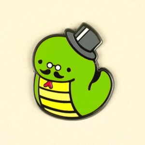May include: A green snake with a yellow and black striped body wearing a black top hat with a white band, round glasses, and a red bow tie.