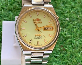 Vintage Orient Automatic Watch: 21 Jewels, Luminous Dial, Day/Date
