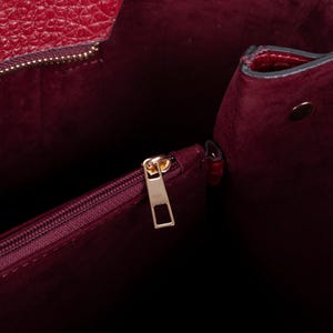 Premium suede interior detail inside structured leather tote handbag