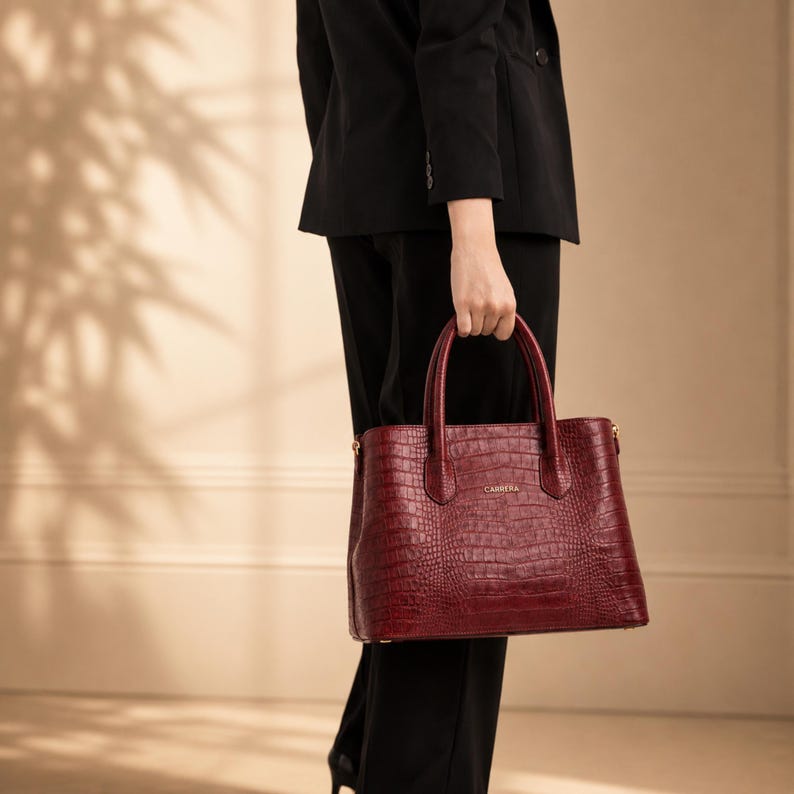 Woman carrying Croco Bourdeaux executive leather tote bag