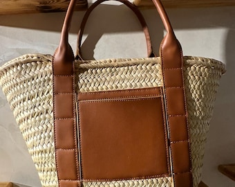 handmade straw tote bag with wide brown leather straps and front pocket moroccan basket summer beach bag