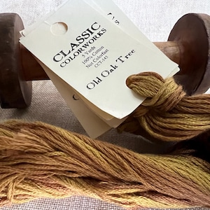 May include: A spool of embroidery floss in shades of brown and yellow, labeled "Classic Colorworks Old Oak Tree" with the details "5 Yards, 100% Cotton, Not Colorfast, CCT-145".