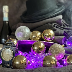 May include: A set of three ceramic mugs with a speckled, matte finish. The mugs are in shades of cream, light gray, and dark gray. Each mug has a simple, minimalist design, perfect for coffee or tea.