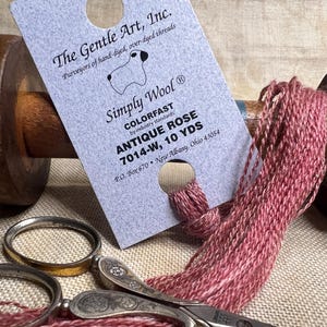 Antique Rose by The Gentle Art Simply Wool is 10 yards over dyed wools thread