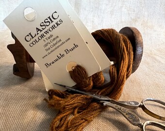 May include: A skein of brown embroidery floss labeled "Classic Colorworks 5 Yards 100% Cotton Not Colorfast www.classiccolorworks.com Bramble Bush"