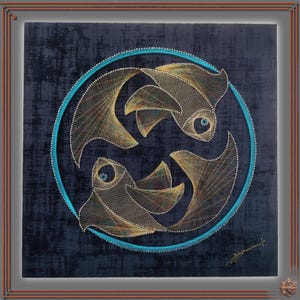 May include: A string art piece featuring the Pisces zodiac symbol. Two fish are depicted within a teal circle, crafted with gold and multicolored thread on a dark blue textured background. The artwork is framed in a brown wooden frame.