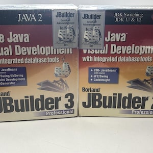 May include: Two software boxes for Borland JBuilder, versions 2 and 3, for Java visual development. The boxes are predominantly red and black, with text including "Pure Java Visual Development" and "Professional". Each box has a "Developer Acknowledgement" sticker.
