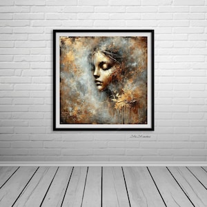 Puede incluir: Impresión artística abstracta en un marco negro. La obra presenta el rostro de una mujer con los ojos cerrados, en tonos dorados, marrones y grises. La pintura mide 61x61 cm.