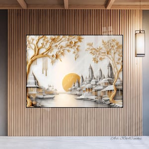 May include: A framed artwork depicting a golden city scene with a large sun. The artwork is 30x40 inches. The city is surrounded by trees with gold-colored leaves. The artwork is displayed on a wooden slatted wall.