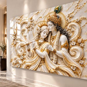 May include: A large rectangular wall art piece featuring a 3D-style relief of Radha and Krishna in white and gold tones. The figures are adorned with intricate jewellery, crowns, and floral garlands, with Krishna playing a flute. The background displays swirling patterns and white flowers, creating a textured, elegant appearance.