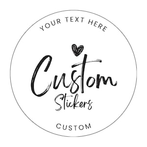 May include: A white circular sticker with black text. The words "Your Text Here" are at the top, with "Custom Stickers" in a cursive font in the center. A small heart is above the word "Custom". The word "CUSTOM" is at the bottom.