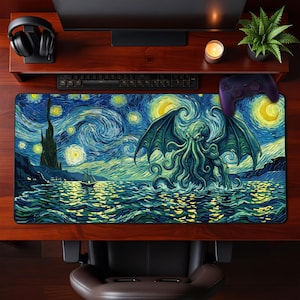 May include: A rectangular desk mat featuring a vibrant, swirling oil painting style illustration of a winged, tentacled creature rising from the ocean at night, with a small sailboat nearby and a starry sky filled with glowing yellow orbs.