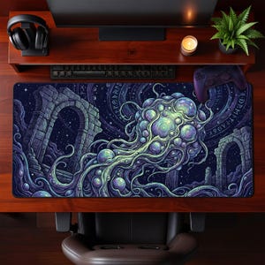 May include: A large, rectangular gaming mouse pad featuring a detailed illustration of a cosmic jellyfish creature with archways and celestial elements. The color palette includes shades of blue, purple, and green, creating a fantasy theme.