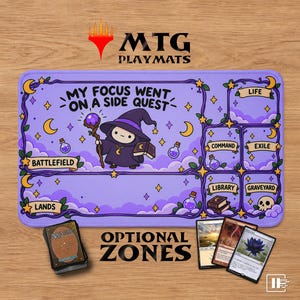 May include: A rectangular purple playmat featuring a cartoon wizard holding a glowing orb and book, with text reading My Focus Went On A Side Quest. The mat includes labeled zones for Battlefield, Lands, Life, Command, Exile, Library, and Graveyard.