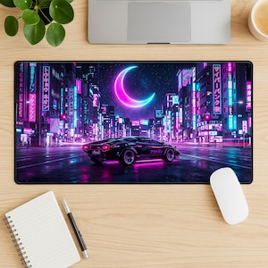 May include: A black rectangular mousepad featuring a neon cityscape with a crescent moon. A black sports car is parked on the wet street. The city has neon signs with Japanese text. The mousepad is on a wooden desk.
