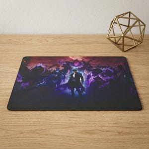 May include: A rectangular mouse pad featuring a dark, atmospheric illustration of a central figure in a black coat surrounded by shadowy, purple-glowing spectral entities against a deep red and black background with a geometric wireframe sculpture.