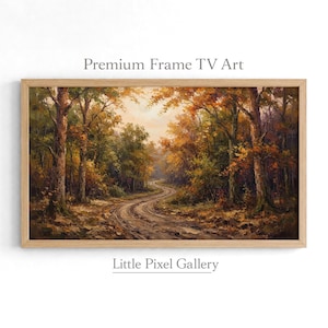 May include: A rectangular landscape painting in a light wood frame titled Premium Frame TV Art by Little Pixel Gallery. The artwork depicts a winding dirt path through a dense forest with autumn foliage in shades of orange, yellow, and brown.