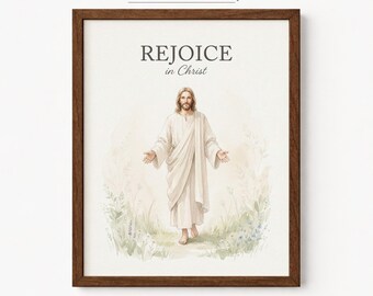 Könnte beinhalten: Ein gerahmter Kunstdruck mit einer Aquarellillustration einer Figur in einem weißen Gewand, die in einem Feld aus grünen und blauen Blumen steht. Der Text REJOICE in Christ ist in Schwarz über der Figur in einem dunklen Holzrahmen gedruckt.