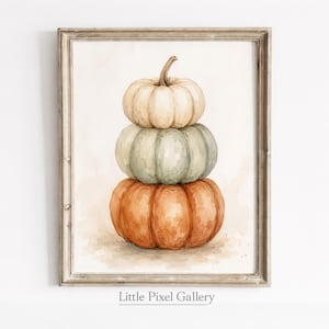 Könnte beinhalten: Ein gerahmter Aquarelldruck mit einem vertikalen Stapel aus drei Kürbissen. Der obere Kürbis ist cremefarben, der mittlere ist salbeigrün und der untere ist orange. Das Kunstwerk befindet sich in einem hellen Holzrahmen mit dem Text Little Pixel Gallery.